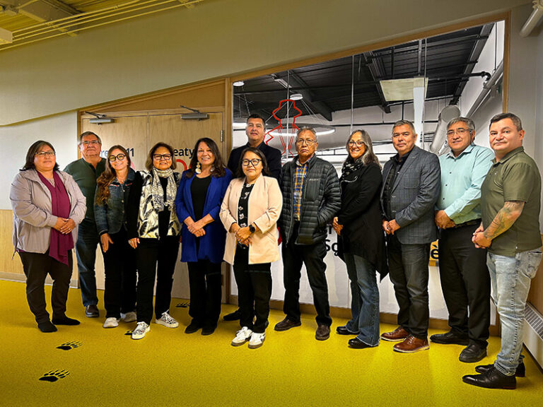 Photo of NIEDB group at Yellowknife Meeting. From left to right: Chief Adeline Football (Tłı̨chǫ Nation), Bob Dickson (NIEDB), Danielle Levine (NIEDB), Dr. Marie Delorme (NIEDB), Dawn Madahbee Leach, Grand Chief Jackson Lafferty (Tłı̨chǫ Nation), Chief Doreen Arrowmaker (Tłı̨chǫ Nation), Chief Allonz Nitsiza (Tłı̨chǫ Nation), Sandra Sutter (NIEDB), Michael Bonshor (NIEDB), Chief Clifford Daniels (Tłı̨chǫ Nation), Maxime Vollant (NIEDB)